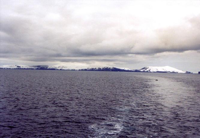 Humpback Whale and Deception Island: Stonethrow Ridge (centre); to the right: Vapour Col and Mt. Kirkwood