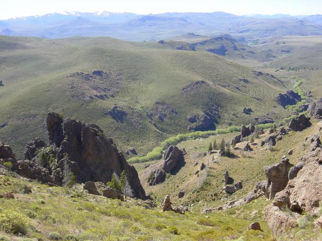 From part way up the mountain, view northwest of stream flowing into Limay River