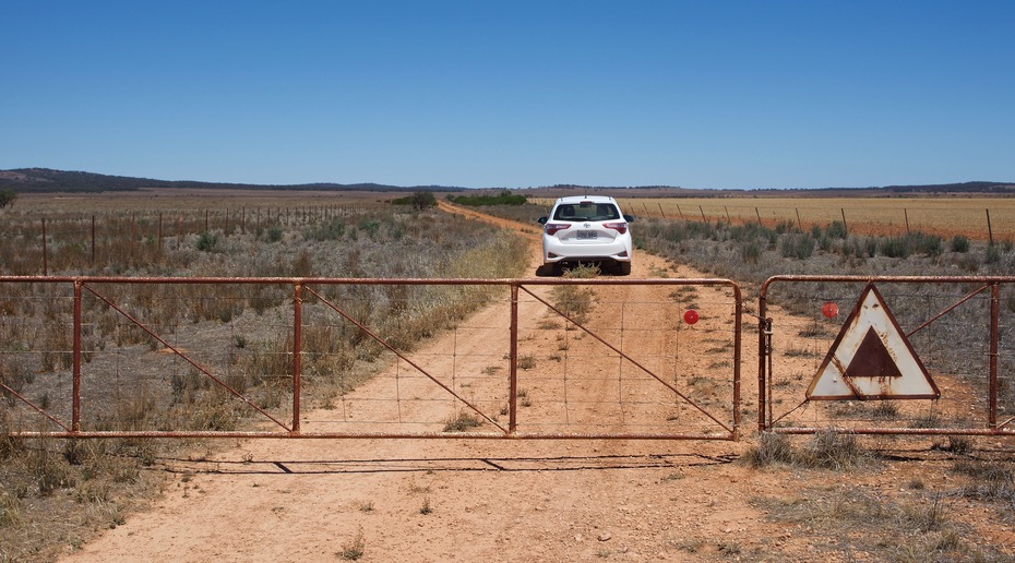 The gated doubletrack farm road, 5 km north of the point