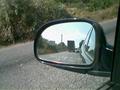#10: In the rear-view-mirror the exit for the village is seen