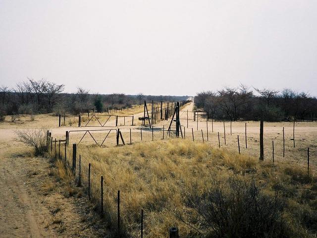 Road passing border fence