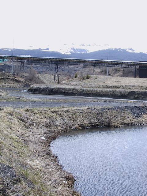The coal conveyor and a  pond where sediment settles out before the water is released