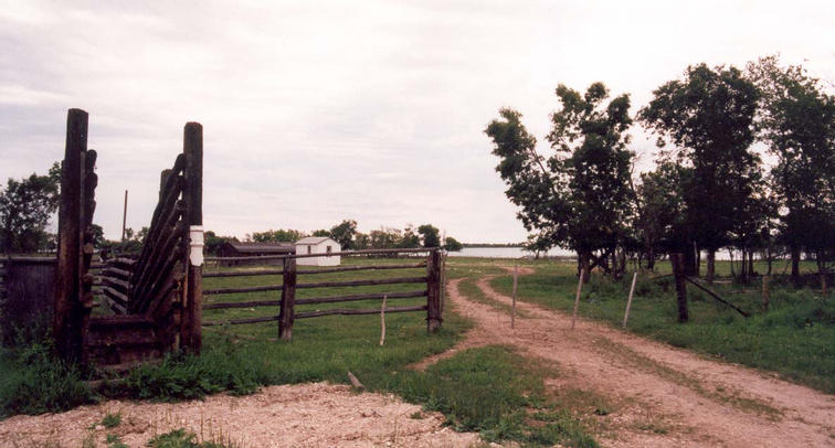 The corral at the end of the frequented road, Lake Winnipegosis in the background