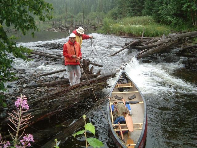 Lining the Canoe over Kathleen Lake Dam