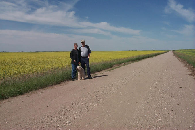 Carolyn, Max and Alan in front of a canola (aka rape) field.