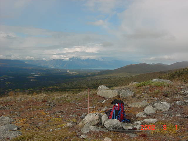 Survey marker with Sheep Mtn/Kluane Lake in back.