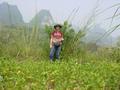 #7: Targ standing on the confluence point, with huangdou (soya beans) in the foreground and karst mountains behind