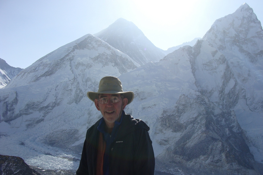 Everest, me, and Nuptse (I’m the one in the hat!)  [This view from Kala Pattar would have had better lighting at sunset, but also much more chance of cloud cover.]