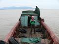 #4: Liu Zifeng on the old wooden boat we chartered