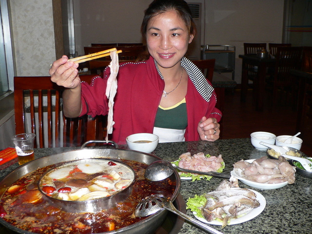 Ah Feng enjoys an extremely spicy, traditional Chóngqìng hotpot dinner on her birthday.