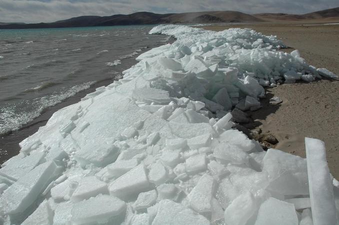 Eastern shore of Namtso lake with piles of ice blocks