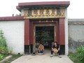 #4: Residents relaxing out front of an ornate doorway