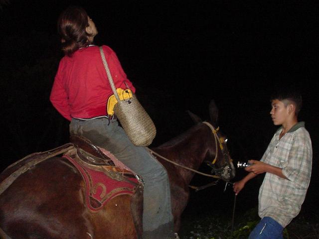 Felipe guiding Maria Eugenia, who is riding the mule