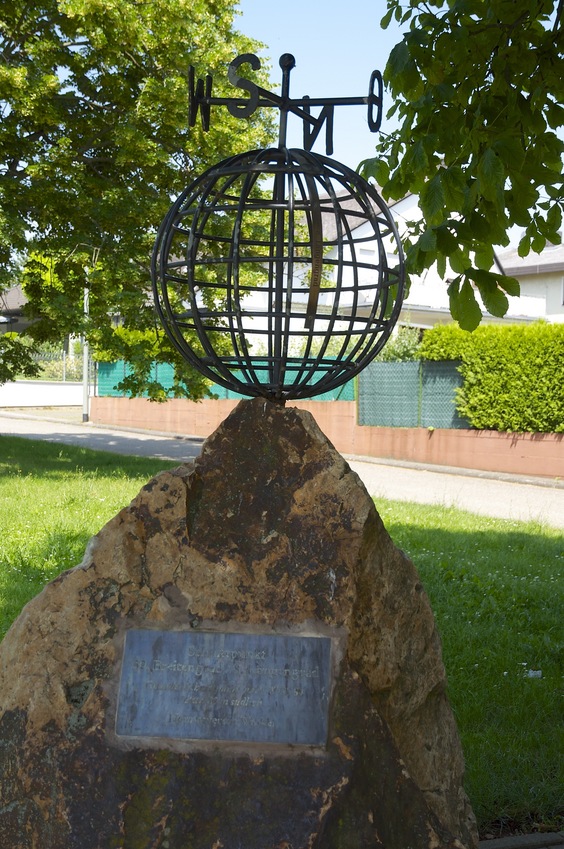 The 'globe' monument, about 80 meters North of the point