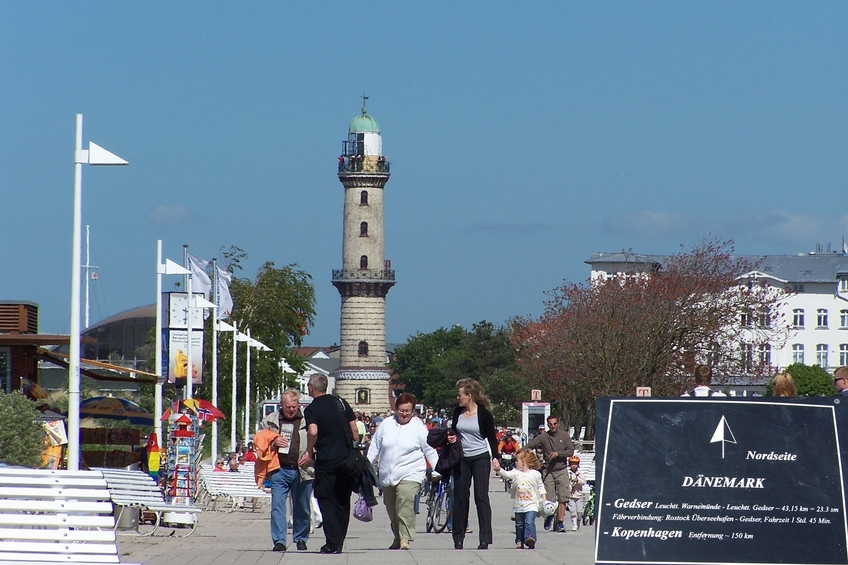 Beach boardwalk and lighthouse in the sea resort of Warnemünde and my tomorrow's destination (Gedser, Denmark)