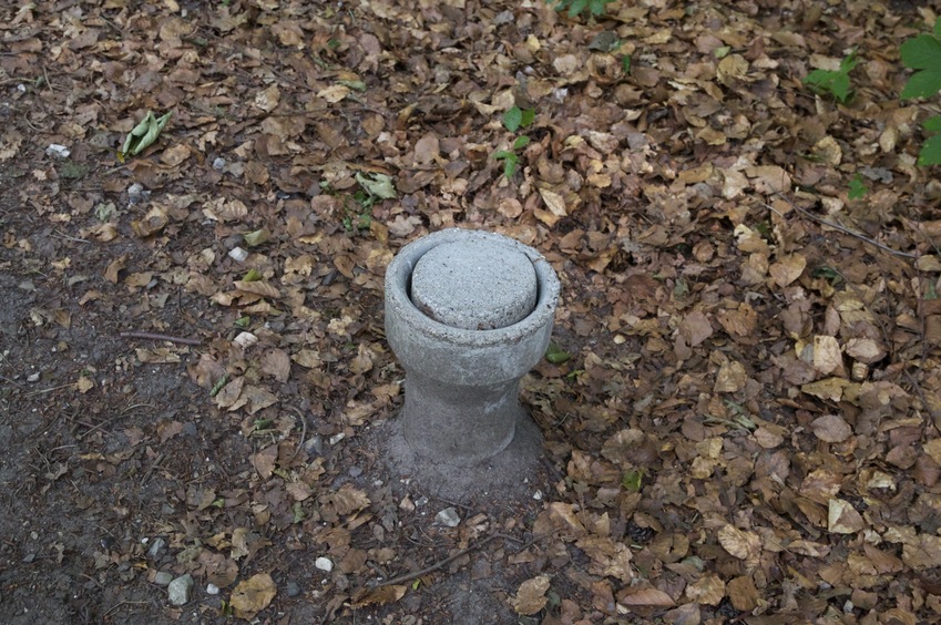 A closeup of the concrete marker that appears to mark the point