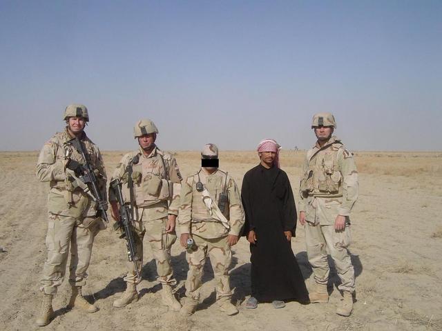 Standing in front of the confluence point (from left to right, LT Paul P., TSgt Jeff G., Karim, Mohanen, & LT Scott T.)