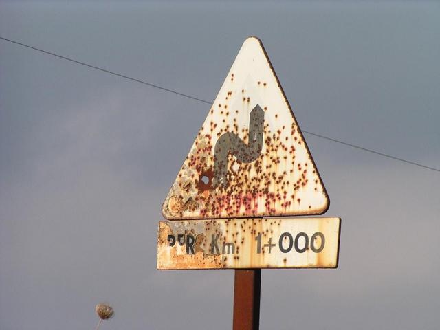 The old road sign has not been changed, yet