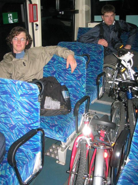 Bikes folded up on bus on a tired trip home.
