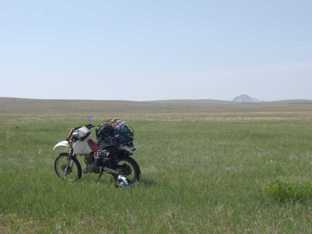 My motorcycle and rock mountain, from the confluence