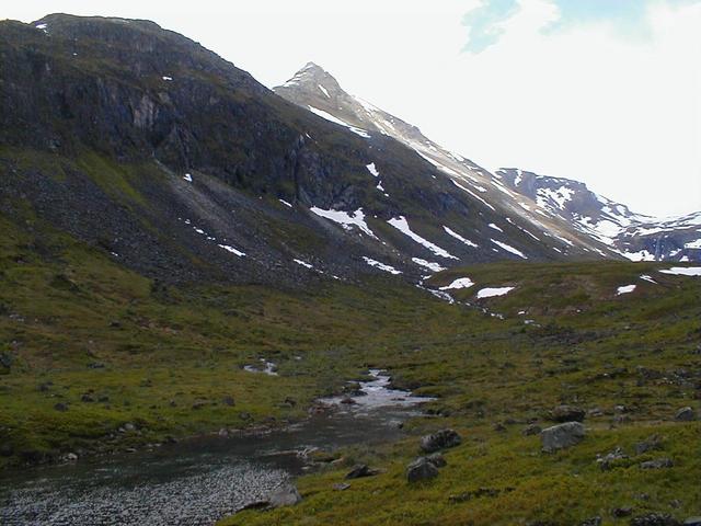 View south to the confluence. The confluence is on the slope in the left of the picture, about where the strip of sun is.