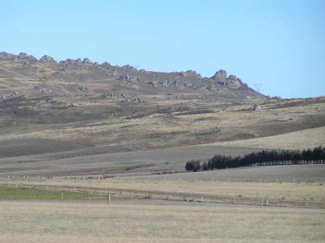 View to the east northeast from the confluence site, showing tors of schist rock in Central Otago.