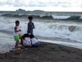 #4: Children playing with the big waves