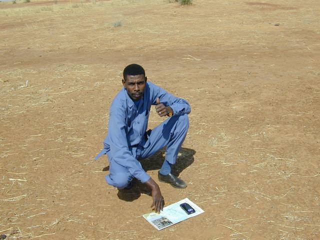 My colleague Awadullah holding the map and GPS