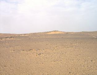 #1: View of confluence site with Nubian Sandstone outcrops, loose fragments and aeolian sand