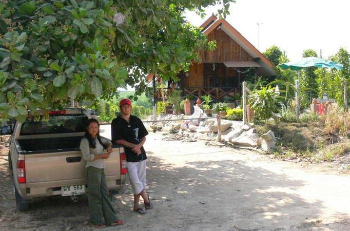Eddie and Wattanah at the entrance to the far, with pretty farm house in back.  95 meters to go