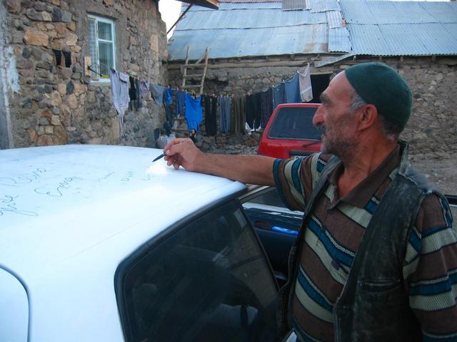 Farmer signing our car
