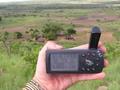#6: The trusty GPS with the coordinates and Mzee Matinde's house in the background.