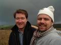 #6: Clayton and me at the spot with grey sky and rainbow