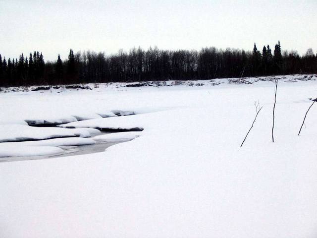 Open water in the middle of the otherwise frozen Kuskokwim River