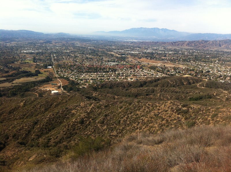 View of the confluence, on the left side of this photograph down the ravine, from the ridge to the east of the point.