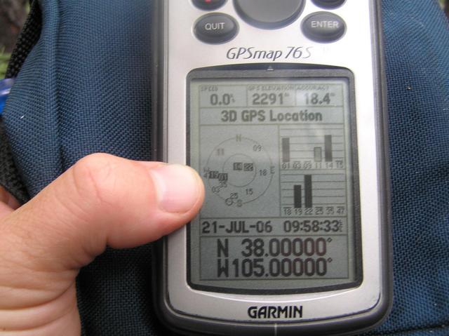 GPS reading at the confluence site--a sight I thought I would never see due to heavy tree cover and steep cliffs.