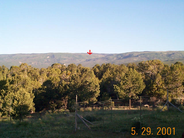 A view of the confluence from our deck. The red arrow is the approximate location 6.68 miles northwest.
