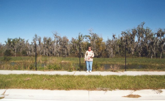 Mom in front of the confluence, facing south.