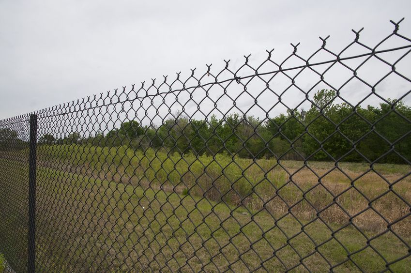 View North from behind the chain-link fence, 81 feet from the confluence point, which lies in the right-hand side of this photo
