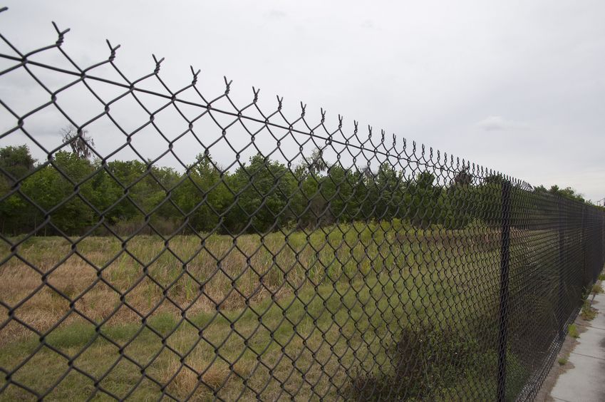 View East from behind the chain-link fence, 81 feet from the confluence point, which lies in the left-hand side of this photo
