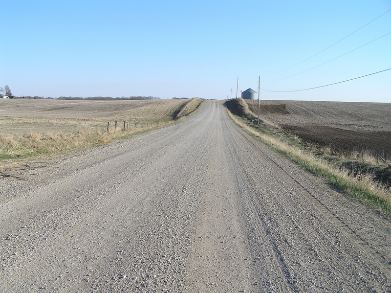 View due south 6 meters east of the 93rd Meridian, down the nearest roadway to the confluence.