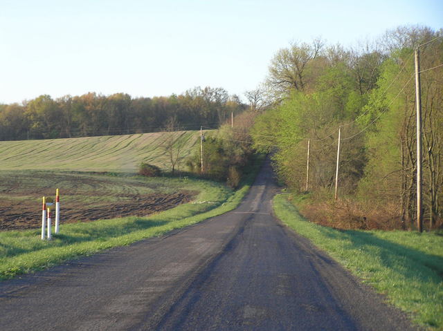 Looking south toward the nearest house to the confluence, on the nearest road to the west of the site.
