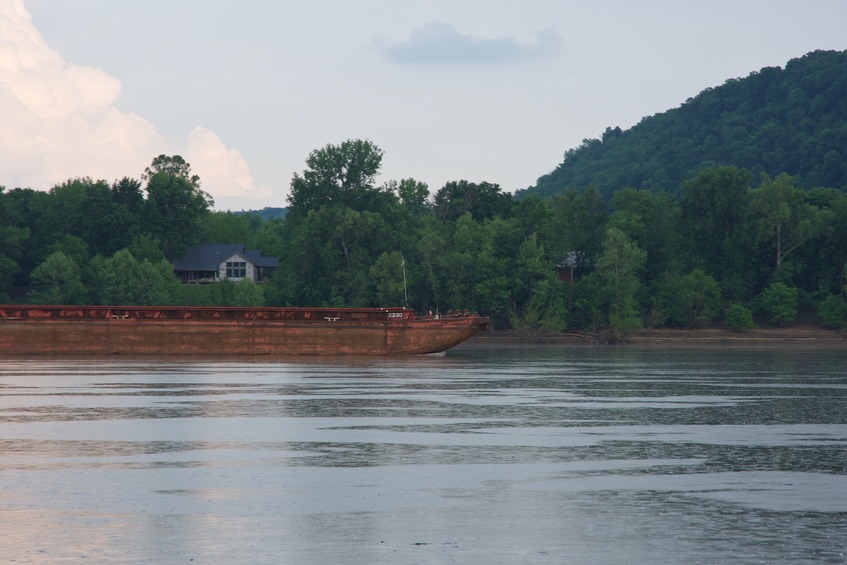 View South of a passing barge, with Fort Knox Army Base (Kentucky) on the far side