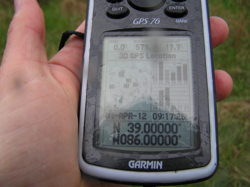 Success despite the rain:  The GPS receiver at the confluence point.