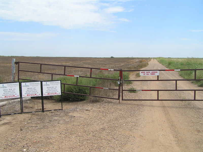 Gas leases along the east-west road, looking east, Kansas on left, Oklahoma on right, 30 meters south of confluence. 