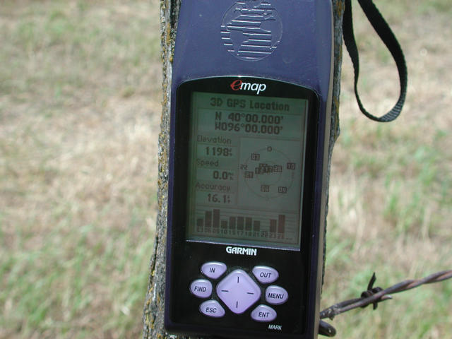 Closeup of GPS on confluence fence post