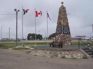 #1: Geographical Center of North America in Rugby, ND with the flags of Mexico, Canada and the USA.