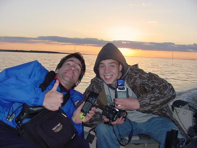 AJ Torgerson, Shiloh Christian School, and Joseph Kerski, USGS, at the confluence in Devils Lake.  Devils Lake is quite famous for perch, walleye, northern pike, and bass fishing.