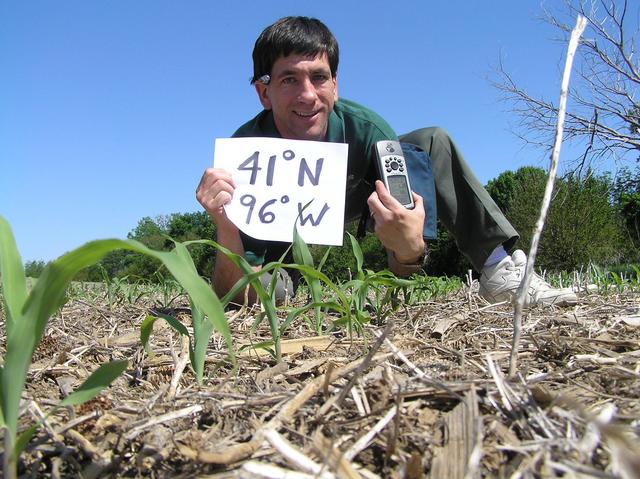 Joseph Kerski in the cornfield at the confluence of 41 North and 96 West.