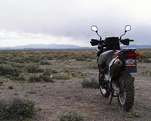 #1: Motorcycle sits on the confluence facing SSW towards the mountains surrounding Golfield, NV.